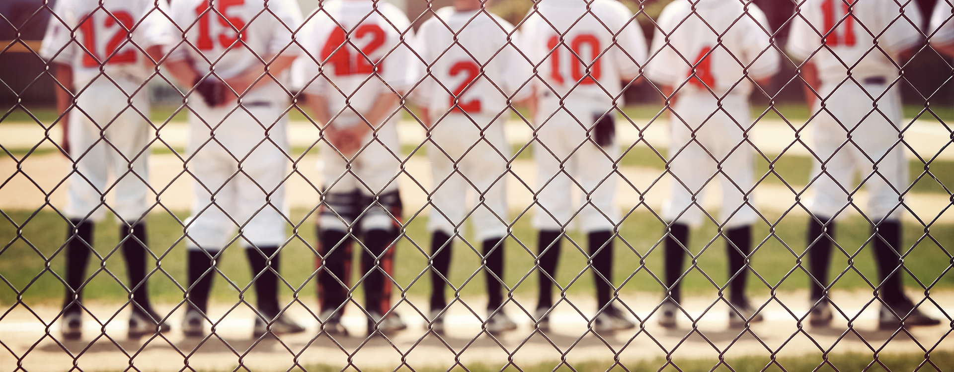 Blurred youth baseball background, children in a row at the begi