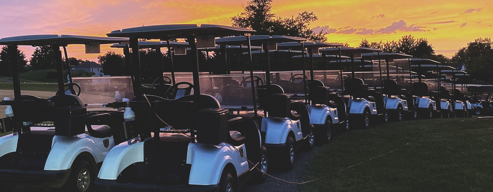 golf course at sunrise golf carts