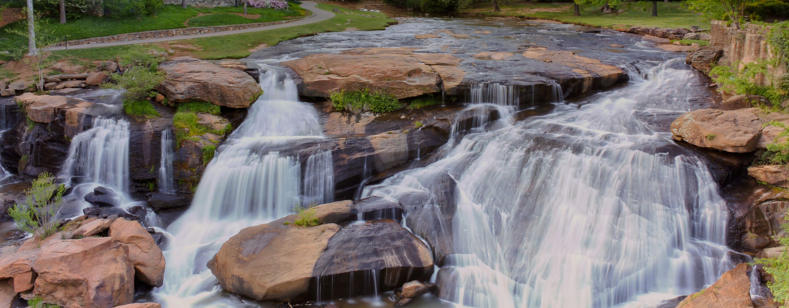 View at Greenville downtown waterfall in Falls park from the han